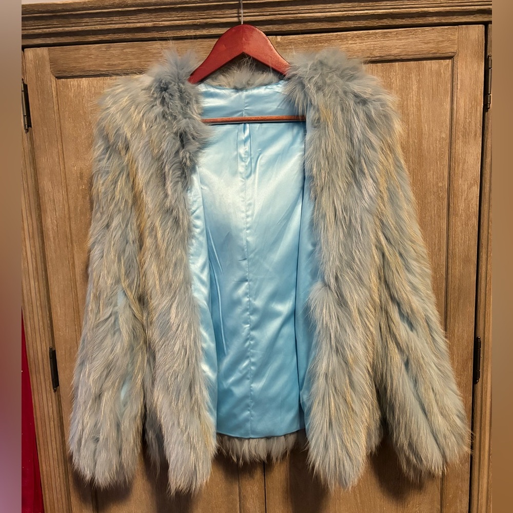 This is a no brand hooded coat made of unknown animal fur, Size 6–8.